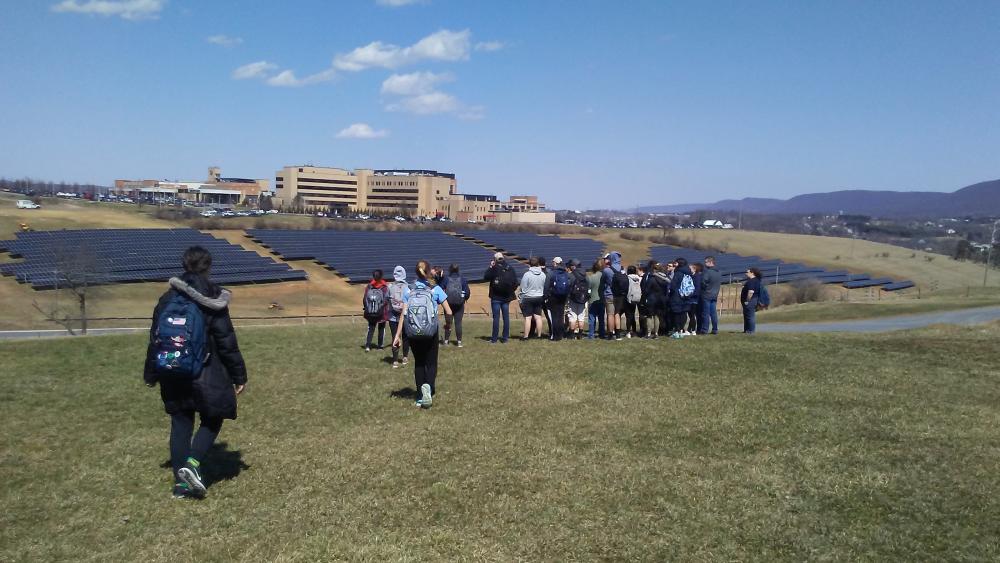 Students visit a solar array near the Penn State University Park campus.